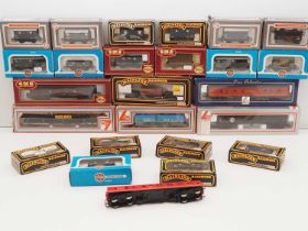 A group of OO gauge vans and wagons by AIRFIX, MAINLINE, LIMA and others - G/VG in G/VG boxes (where