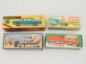 A group of vintage tinplate and plastic Czechoslovakian made toys comprising 2 lorries, a battery