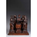 Groupe de bois sculpté en chêne représentant la Circoncision, avec la figure centrale tenant l'