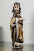 Saint Antoine barbu, aux longs cheveux bruns bouclés, portant un manteau doré sur une robe fluide