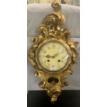 A GILTWOOD ROCOCCO STYLE CARTEL CLOCK WITH GILT HANDS MARKED WESTROOD TOREBODA