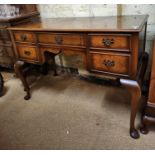 A WALNUT KNEEHOLE DRESSING TABLE OF 5 DRAWERS WITH STOOL