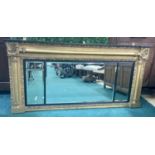 A REGENCY GILDED OVERMANTEL OF 3 MIRRORED DIVISIONS WITH EBONISED FILLETS C.1810