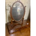 A MAHOGANY OVAL DRESSING MIRROR WITH 2 DRAWERS