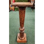 A MAHOGANY TURNED PEDESTAL WITH LATER SQUARE TOP