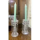 A PAIR OF REGENCY CUT GLASS CANDLESTICKS WITH LUSTRES - BALUSTER STEM ON ROUND BASES