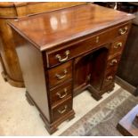 A SMALL MAHOGANY KNEEHOLE DESK WITH RECESSED CABINET - TWIN PEDESTAL -ONE LONG DRAWER WITH 3