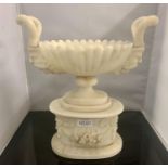 A LARGE ORNATE ALABASTER TWO HANDLED TAZZA WITH NORSE GOD HEAD HANDLES MISSING RINGS