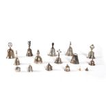 Lot consisting of fifteen silver bells and a small metal one from various periods