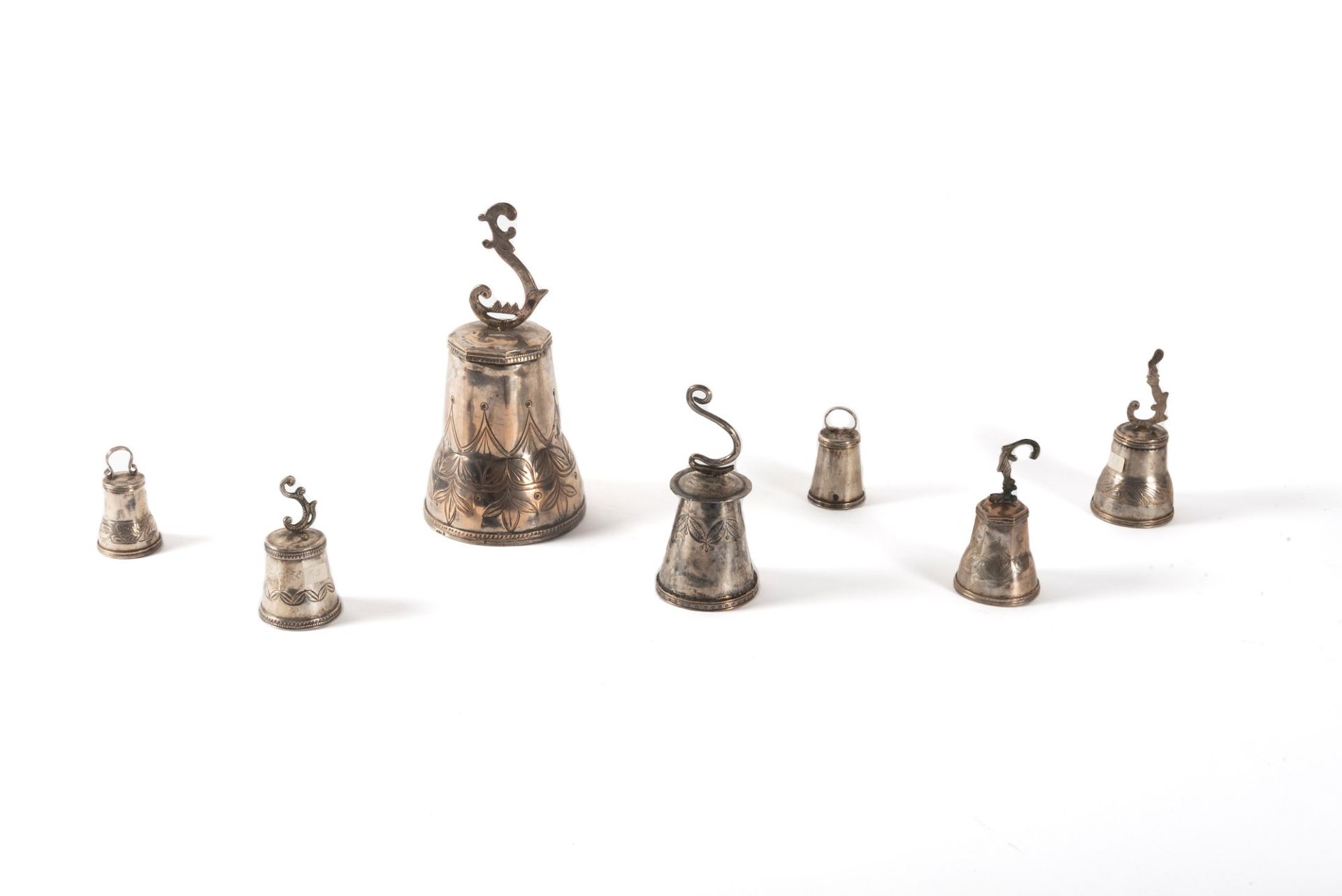 Lot consisting of seven silver-plated metal bells, 19th-20th centuries