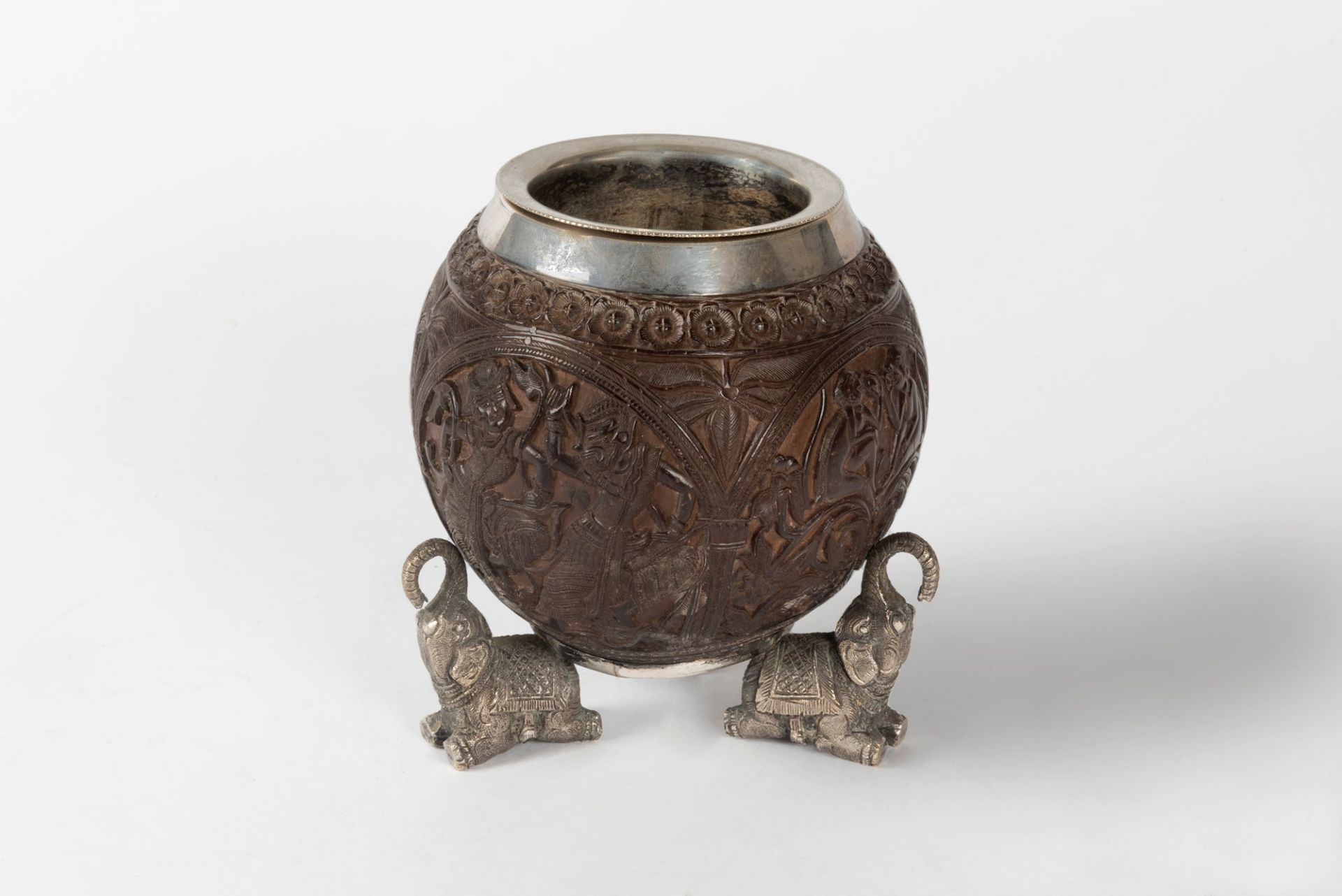 Finely carved coconut, with elephant-shaped feet in silvered metal, India 19th century