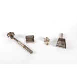 Lot consisting of three metal rattles and a small silver box, 20th century