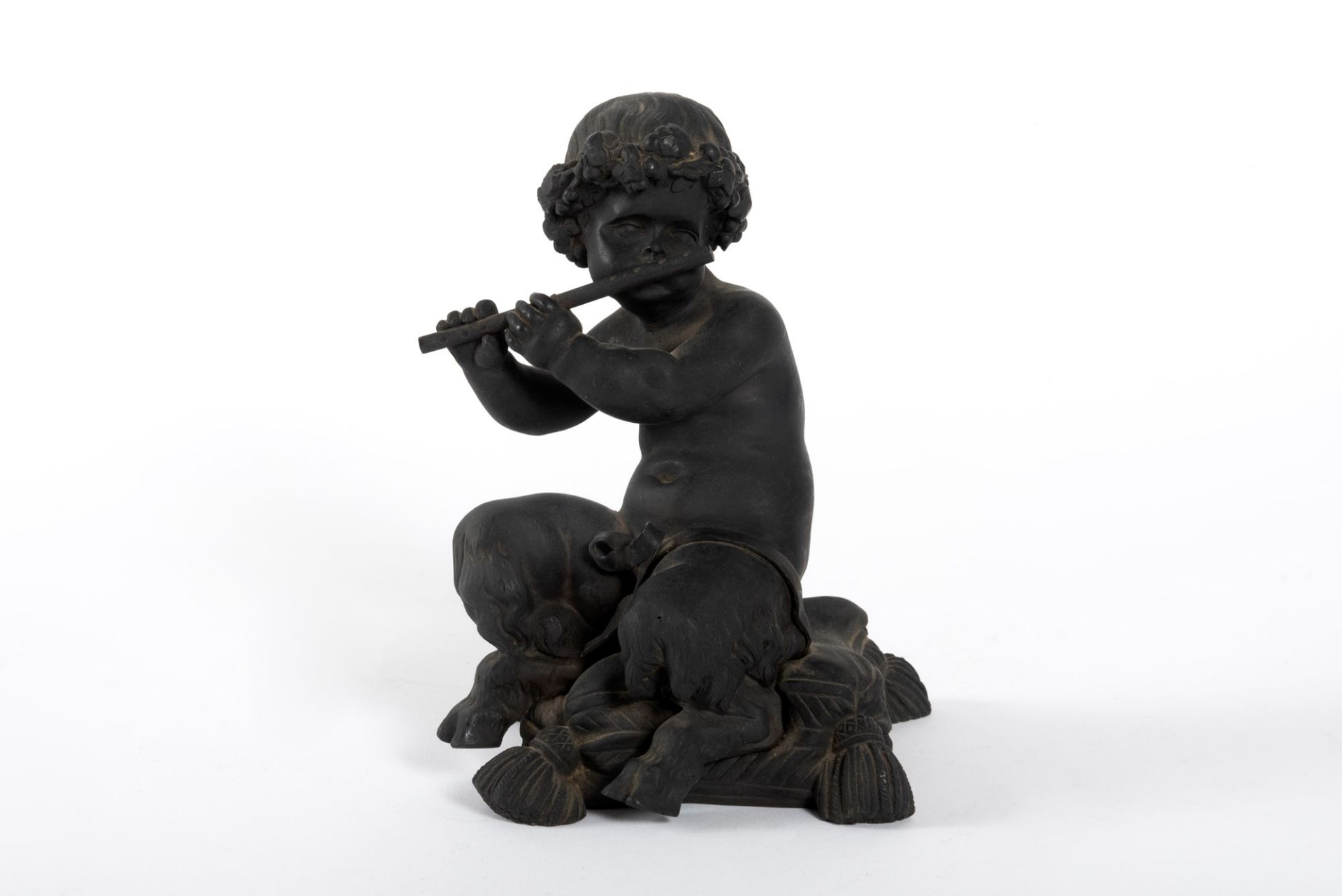 Bronze sculpture depicting a faun playing the flute, 20th century