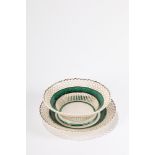 Lot consisting of a basket and a plate in white and green maiolica, 20th century