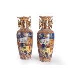 Pair of two-handled vases in polychrome porcelain, decorated with reserves with figures of musicians