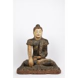 A polycrome wood seated Buddha. South East Asia, early 20th century