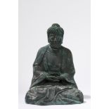 A dark patina embossed Buddha. China, 20th century