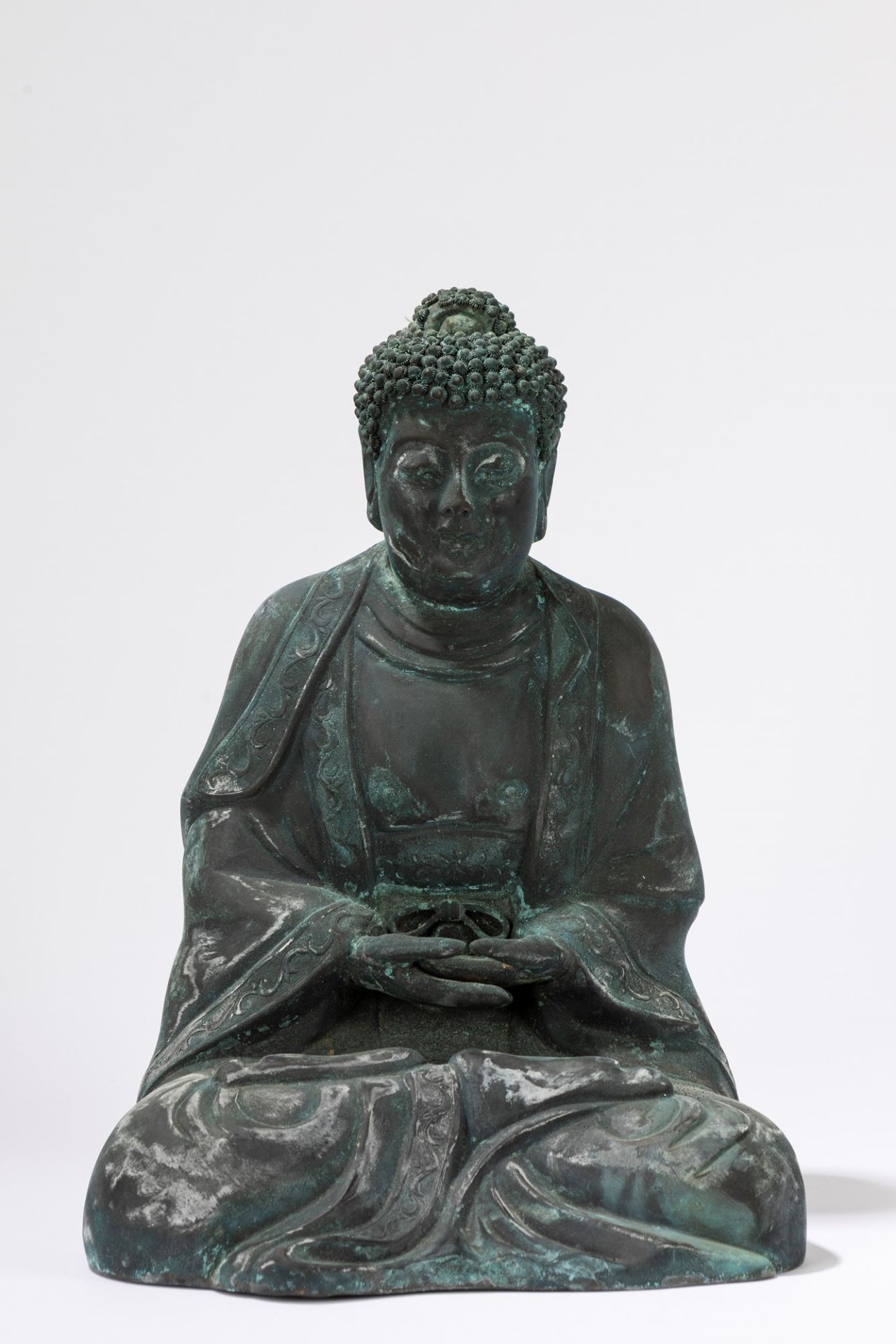 A dark patina embossed Buddha. China, 20th century