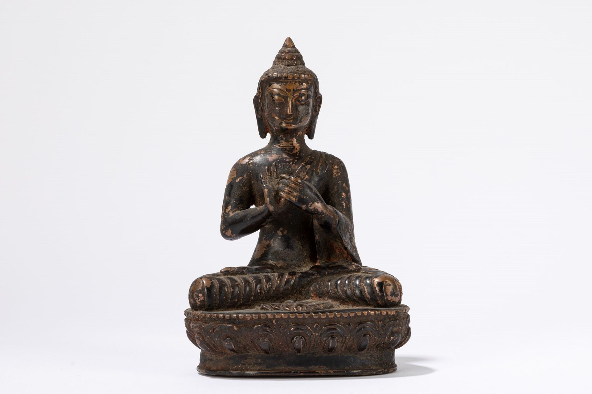 A partial gilt bronze seated Buddha. China/Tibet, 19th century