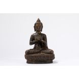 A partial gilt bronze seated Buddha. China/Tibet, 19th century