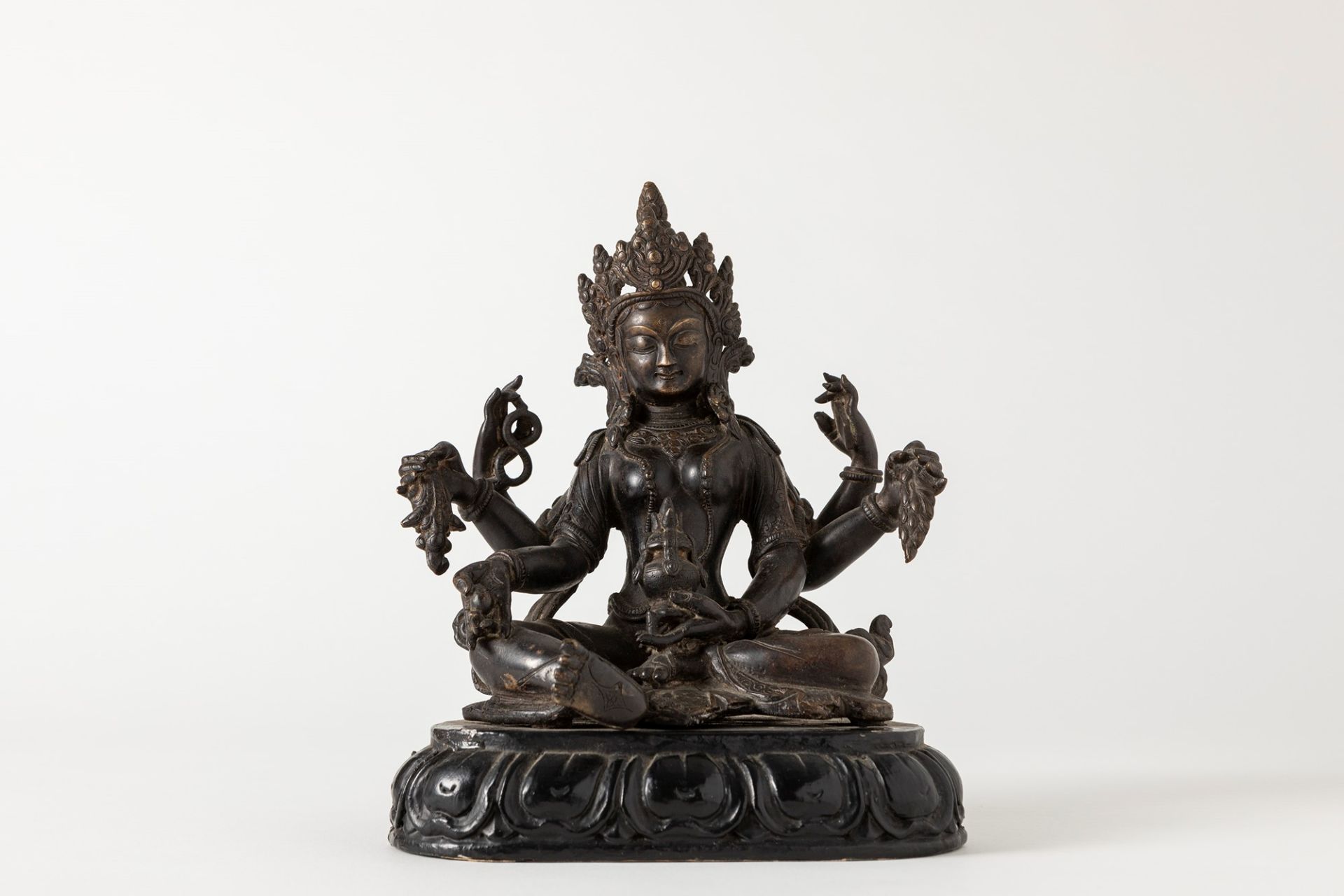 A dark patina bronze Vasudhara. Tibet, 19/20th century