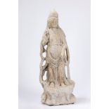 An antique indian stone sculpture depicting a Guanyin