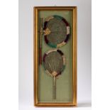 Two richely decorated wooden fans. Late 19th century