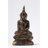 A part gilt wood seated Buddha. South East Asia, 19th century