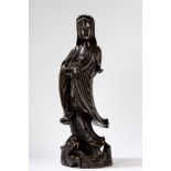 A finely carved wooden Guanyin. China, 20th century