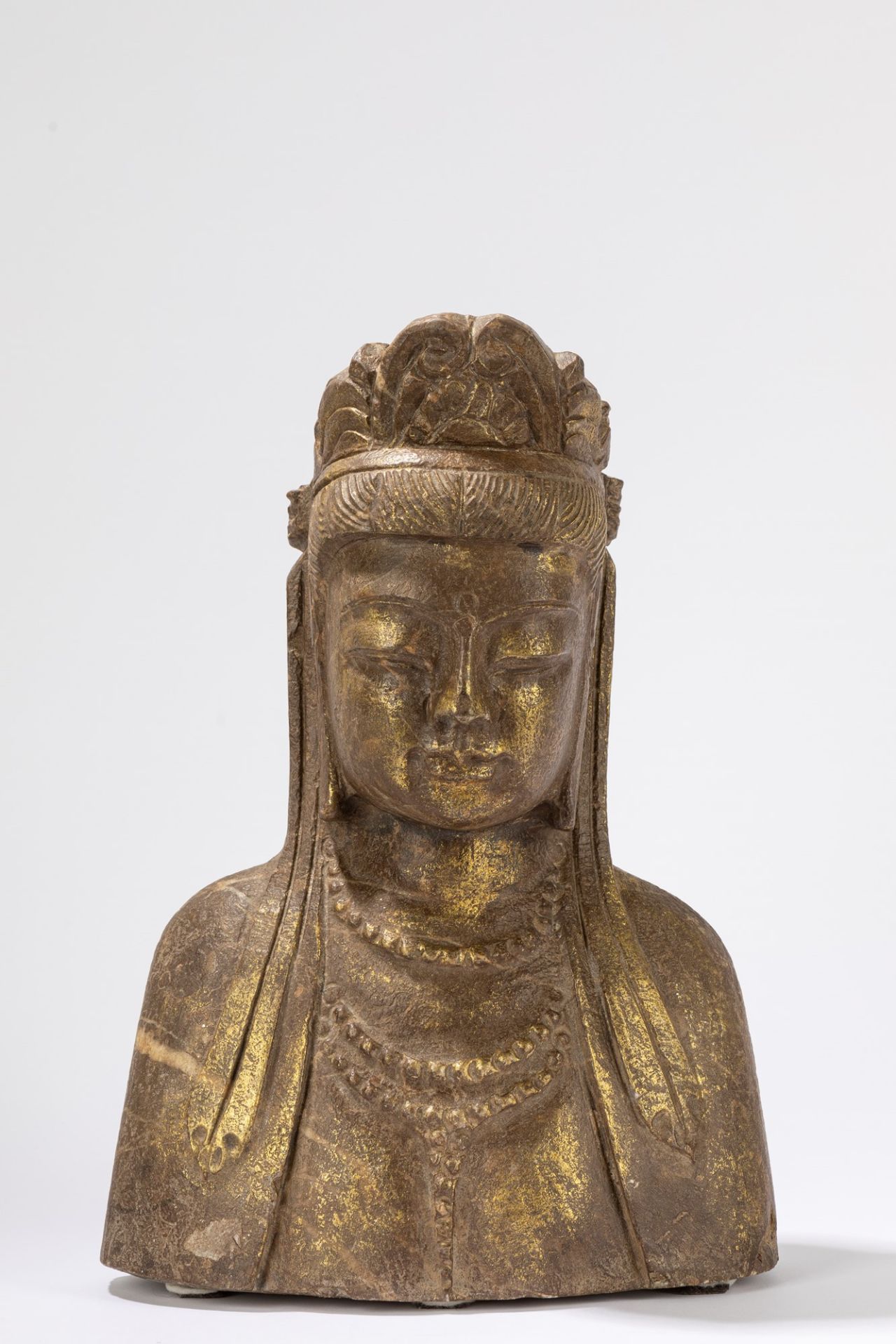 A gilded stone bust of a Guanyin. Oriental manufacture 19/20th century