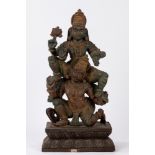 A polycrome wooden sculpture depicting Parvati and Shiva. 20th century