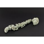 A celadon jade ruyi scepter. China, late 19th c.