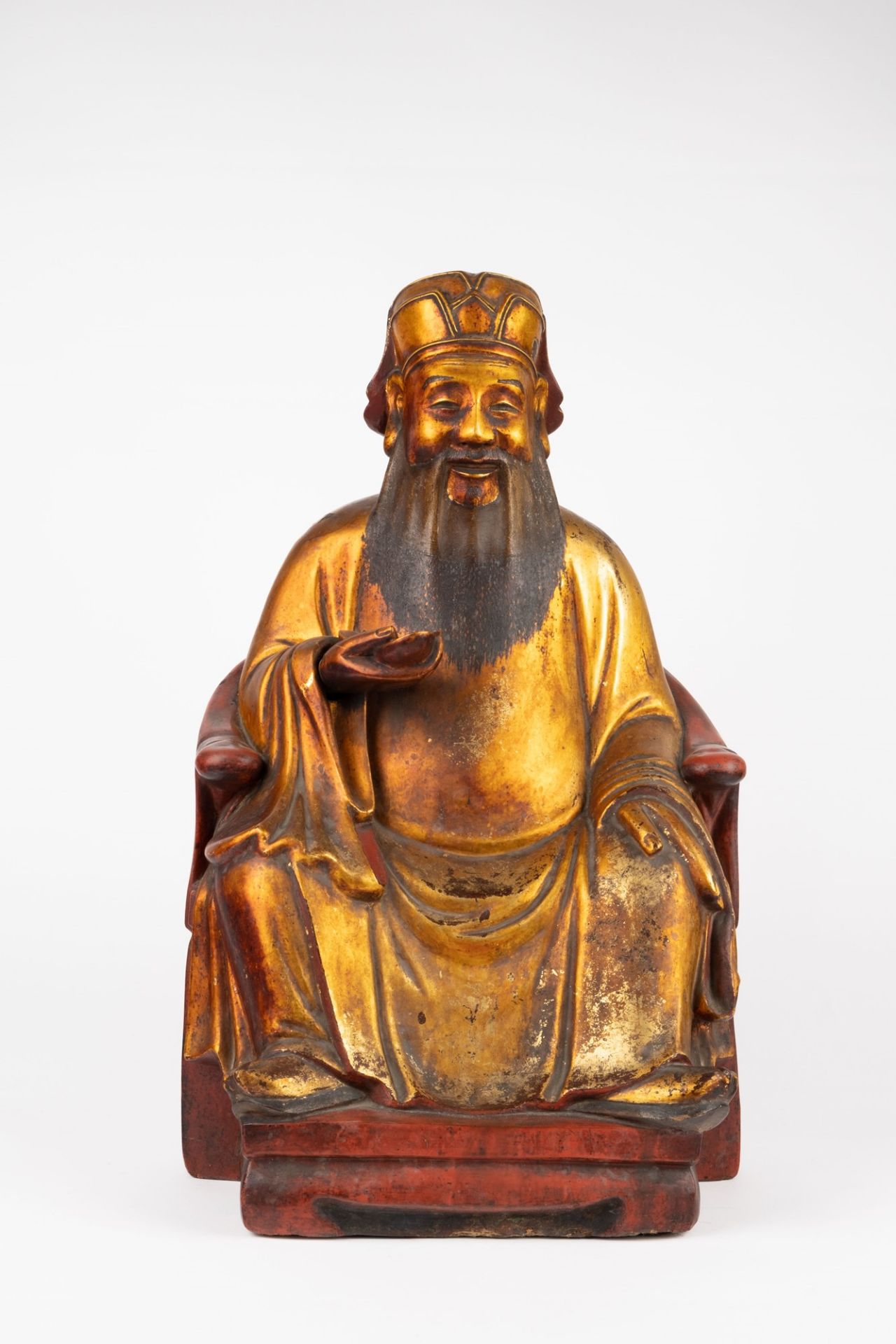 A Papier-mâché seated figure. China, 19th c.
