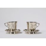 A pair of silver cups and saucers. China, 19th/20th c.