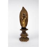 A carved wood standing Buddha. Japan, late 19th c.