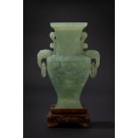 A green jade archaic shape vase. China, 20th c.