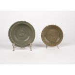 Two small celadon plates. China, 15th/16th c.
