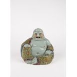 A Famille Rose smiling budai. China, early 20th c.