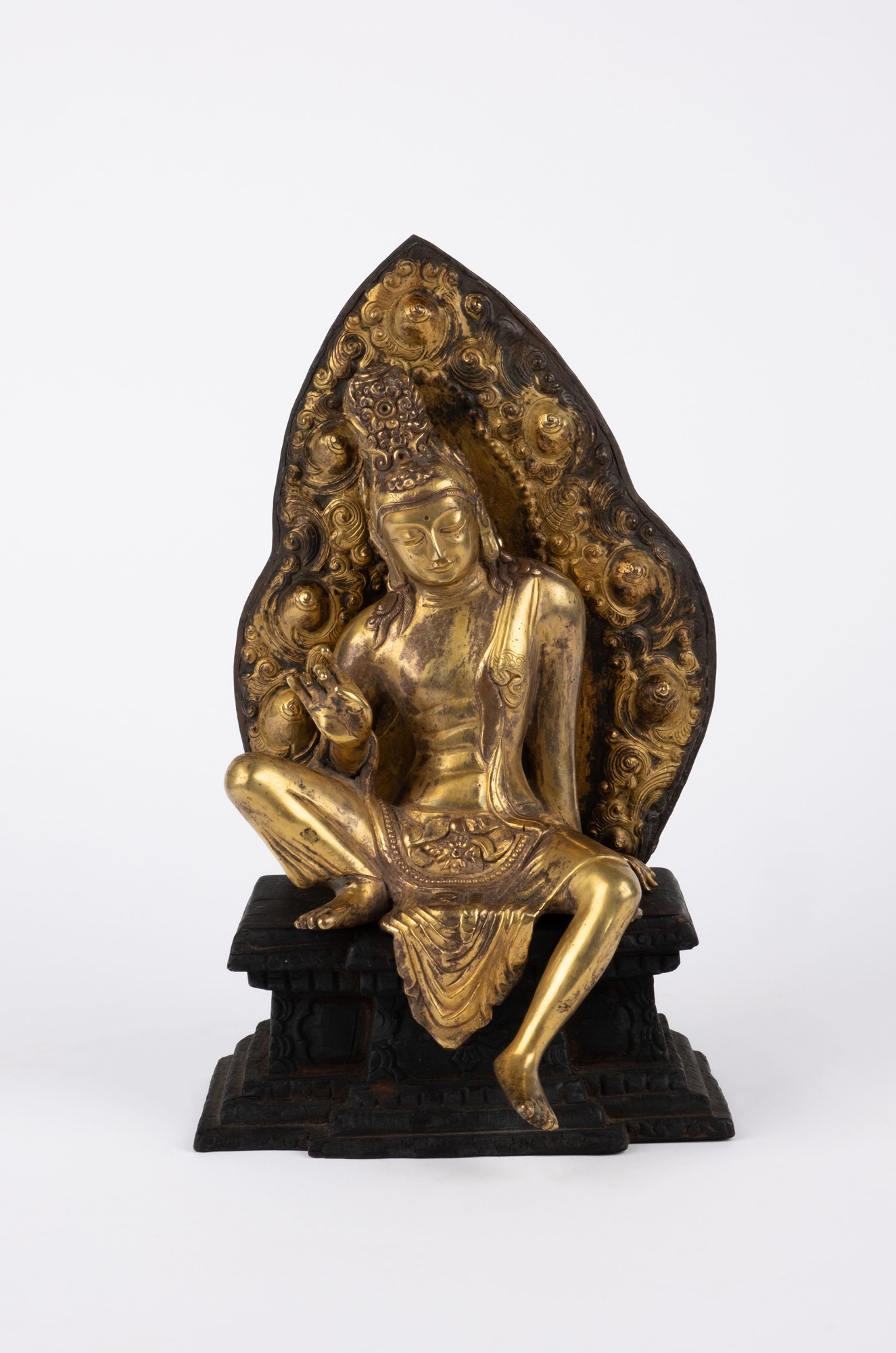 An antique bronze seated Buddha