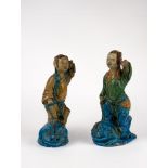 A pair of figures standing on frogs. China, 19th c.