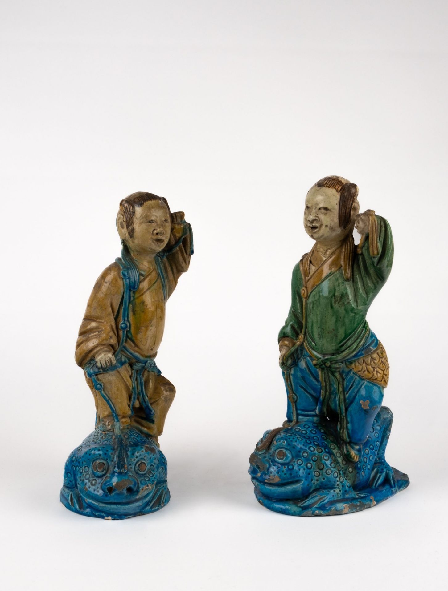 A pair of figures standing on frogs. China, 19th c.
