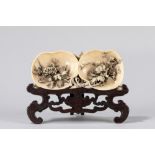 ☼ A finely carved ivory plaque double peach shaped. China, Canton, mid 19th century