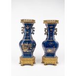 A pair of two-handled blue vases. China, late 19th c.