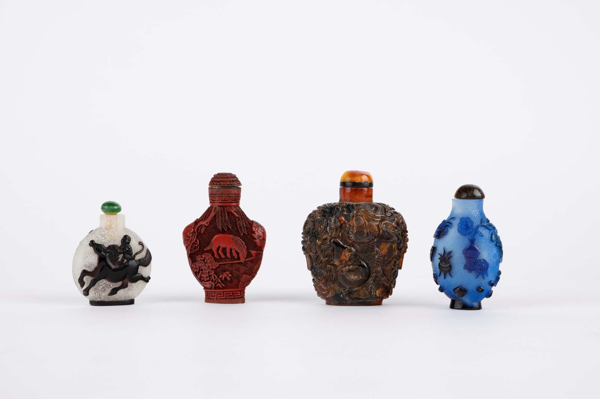 Lot of four snuff bottles. China, 19th/20th c.