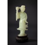 A green jade carving of a lady with flowers. China, 19th c.