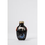 A black ground porcelain snuff bottle. China, late Qing dynasty