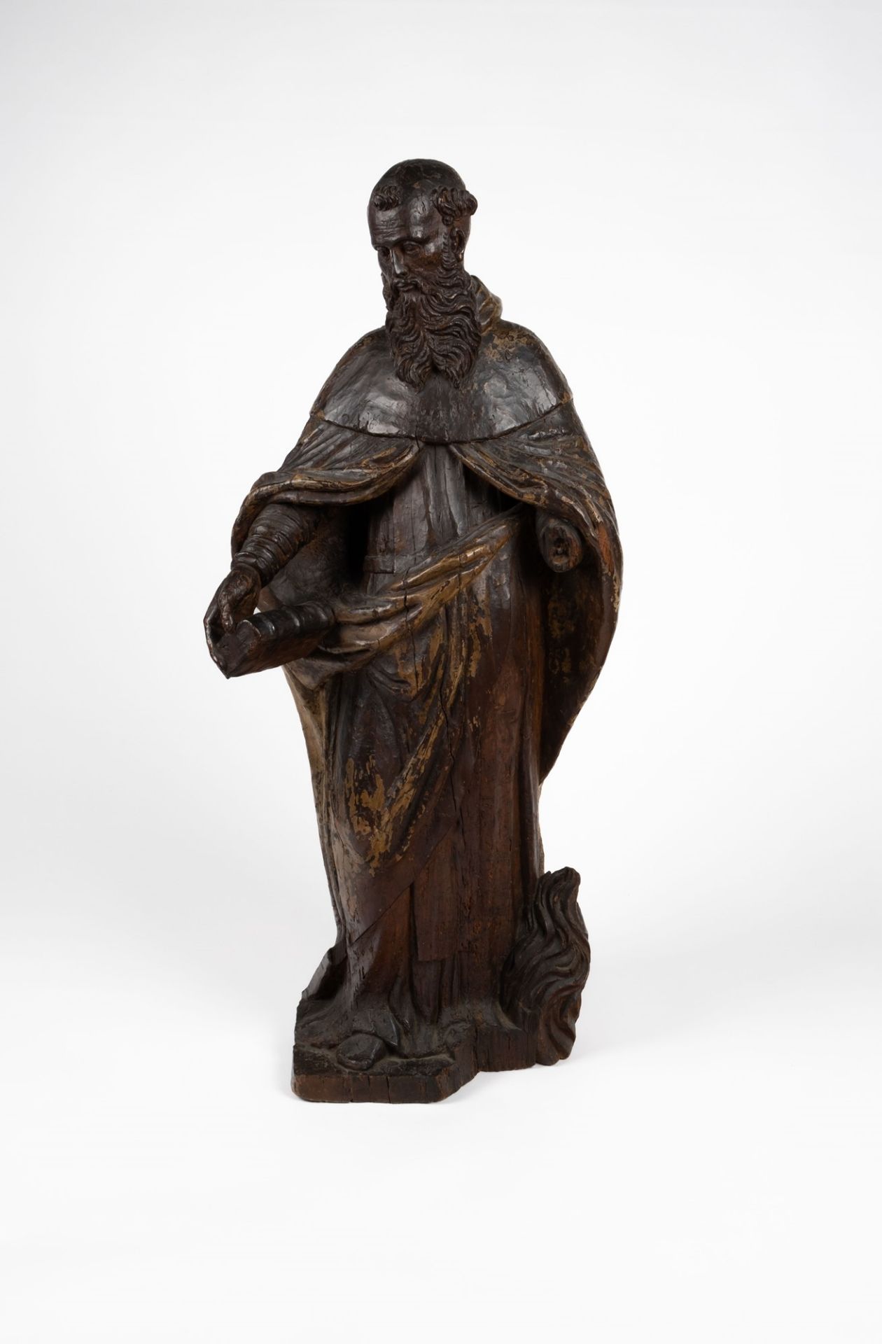 A carved wood sculpture with traces of lacquering depicting a Saint. XVIII century