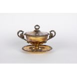 Two-handled cup with lid and saucer. France, first half of the 19th century