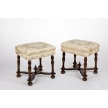 A pair of walnut stools, 17th c.