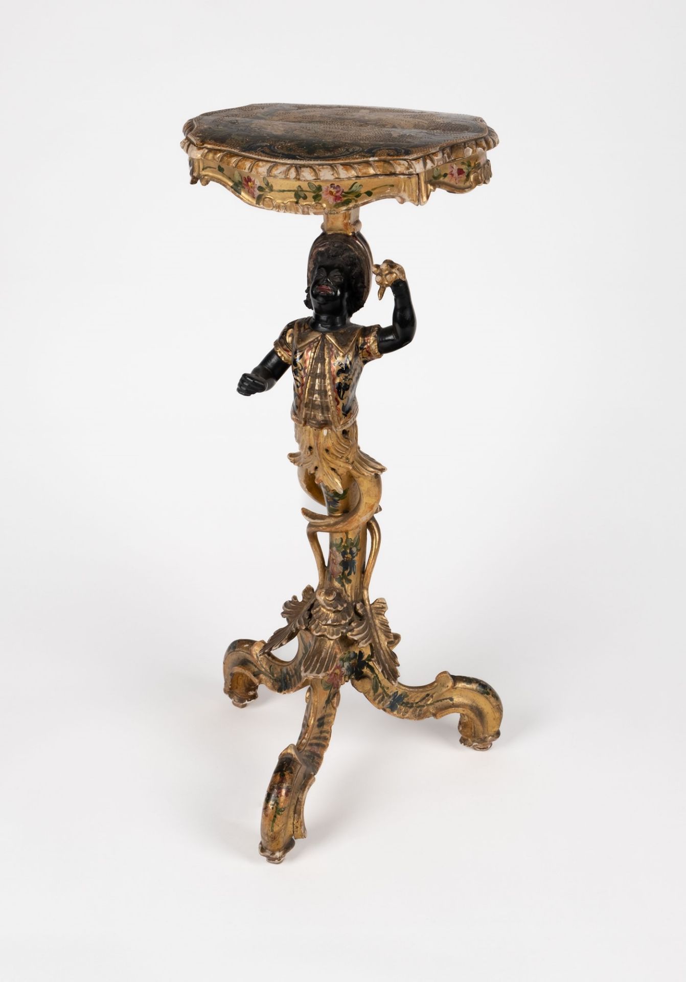 A carved lacquered and gilt-wood gueridon, in Venetian 18th c. style